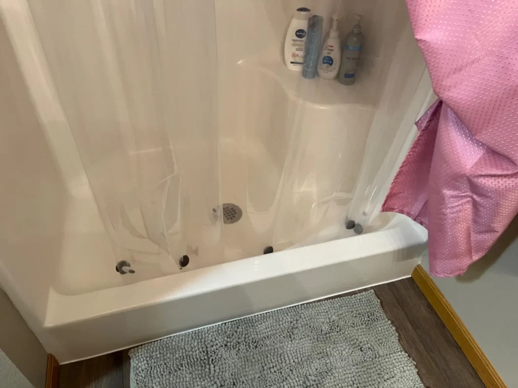 Shower curtain magnet weight. best solution on how to prevent water from leaking outside a shower curtain.